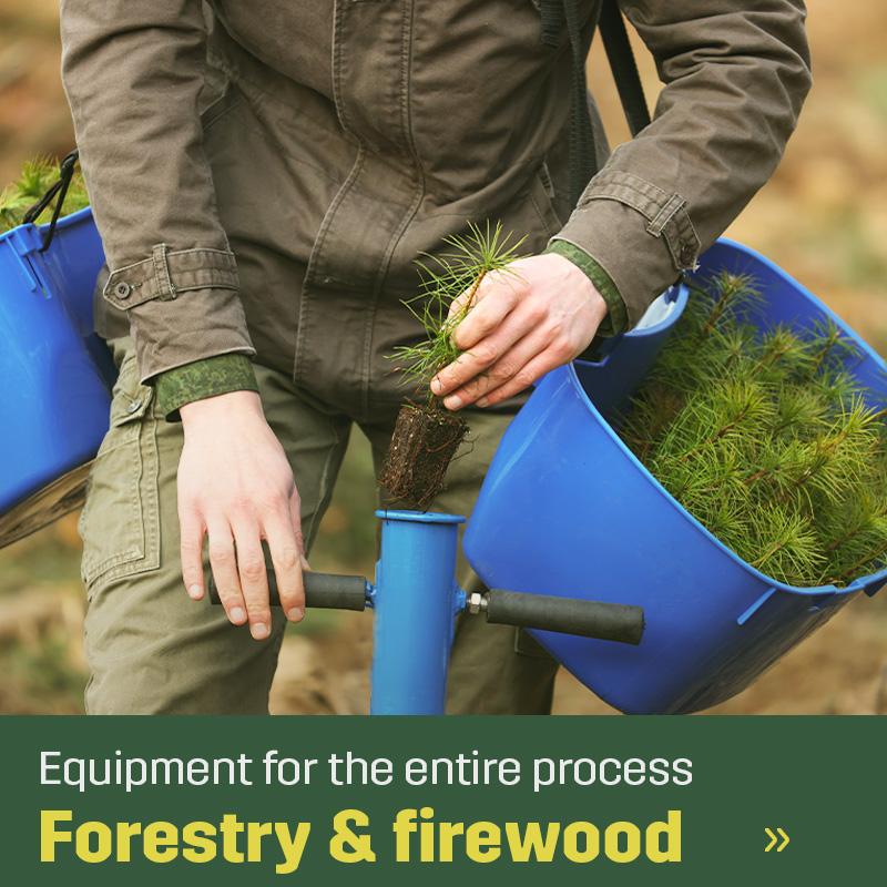 Person planting a seedling using a handheld planting tool and carrying a tray of plants. Sagros range for forestry includes equipment used for planting and work in forest environments.